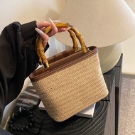 Straw bag woven portable bucket bag womens 2025 new summer versatile messenger bag seaside vacation