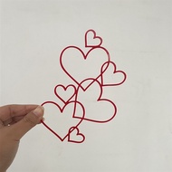 Mica Topper with 7 red interlocking hearts