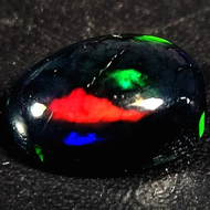 2.51 CTS NATURAL AAA+ AWESOME COLOR PLAY OVAL CABOCHAN ETHIOPIAN BLACK WELO OPAL