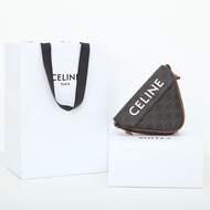 CELINE CLUTCH ON STRAP TABOU IN TRIOMPHE CANVAS AND CALFSKINTAN
