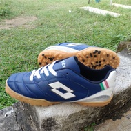Lotto navy mini soccer futsal shoes are stitched all around