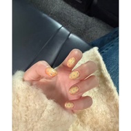Cute short nails with custard yellow polka dots, handmade wearable nails.