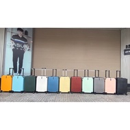 Striped suitcase with 4 zipper corners