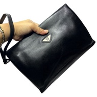 Pre-loved Wanlima black leather clutch bag