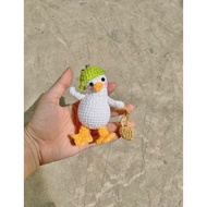 Silly Duck wool keychain holding school bag