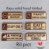Staff only writing, no longer, exit out, shelf package here, fierce dog, door cover back, signage, e