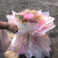 Princess bouquet of 7 tubes stuffed with money makes a meaningful gift