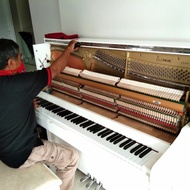 stem dan service piano merk yamaha bekas