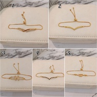 Gold plated money91 metal drawstring bracelet