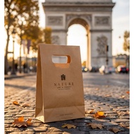 kraft bag with arc de triomphe charm