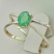 Minimalism style yellow gold ring with natural emerald and diamonds.