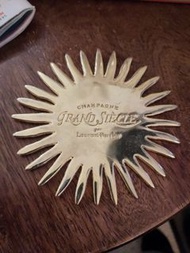 Four metal grand siècle coasters. Vintage Laurent perrier