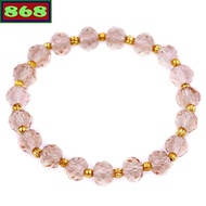 Brown glass bracelet with 8 cups of gold beads