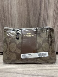 Coach 58035 ～Corner Zip Wristlet in Signature Canvas featuring the Khaki Saddle 2 colorway
