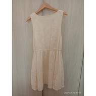 Beige color mini dress.