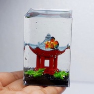 Miniature clay betta with stone in the tank