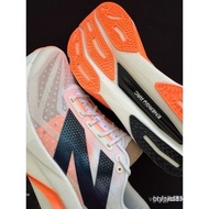 Ladies Running Shoes FuelCell Elite V4, The Color Is White Angola And Hot Mango Color EZRA.