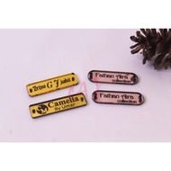 BLACK PAINT ACRYLIC LABEL REBRANDING/LABEL