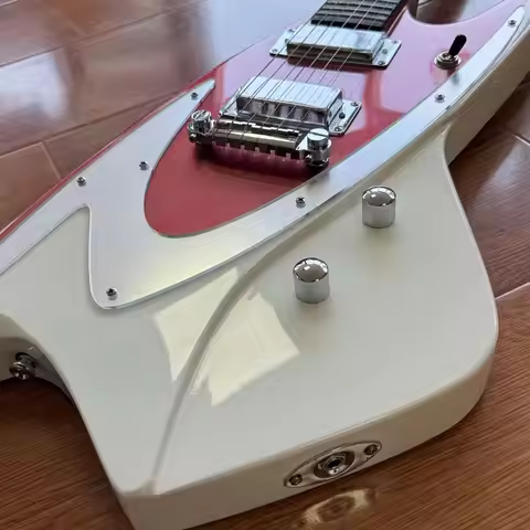 Electric Guitar Features A Color Scheme Of Metallic Red And Ivory White It Is Equipped With Silver M