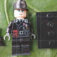WW 2 German in black uniform with standee plate.(Plastic toy and less than 2 inches)