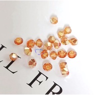 50 4mm conical beads with premium metallic gold Austrian crystal