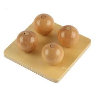 Drop wooden balls on small pegs