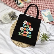 Black canvas tote bag with beige pattern kind do good things to carry things for going out to school