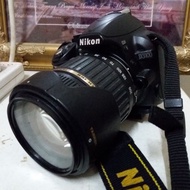 Nikon D3100 with Tamron 22 - 200 mm lens.