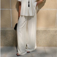 OMAI wide-leg pants designed with wrinkled silk and back zip - BQ16