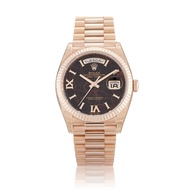 Rolex Day-Date Reference 128235, a rose gold automatic wristwatch with day and date, circa 2023