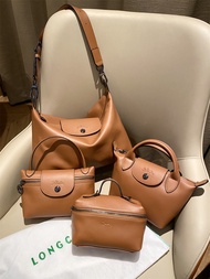 Longchamp cognac PU leather crossbody bag set with 4 bags and carrying case. Brown leather bags with