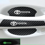 8 ชิ้น/เซ็ตส่องสว่างมือจับประตูสติกเกอร์ Universal หัวเข็มขัดป้องกันฝาครอบรถจับประตูชาม Anti-Scratch ป้องกันฟิล์มสติกเกอร์คาร์บอนไฟเบอร์สำหรับ Toyota