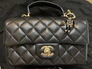 Chanel top handle mini flap bag  with lion charm