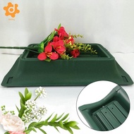 [utruiut0k] Floral Funeral Vase in Saddle Shape, Containing Two Floral Foam Flowers.