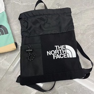 THE NORTH FACE 2023สินค้าใหม่นำเข้ายอดนิยมแบบพกพากระเป๋าสะพายไหล่ลำลองกลางแจ้ง Tas Sekolah Serut อินเทรนด์กระเป๋าสไตล์เกาหลีกระเป๋าเป้สะพายหลังของแท้