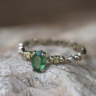 14k gold ring with emerald and diamonds.