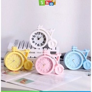 Analog bicycle-shaped alarm clock