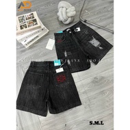Women's high-waisted jeans shorts with slight tears, styled on both sides, pants with embroidered po