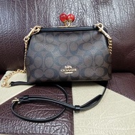 COACH C1452 深咖啡色老花LOGO 復古珠扣斜背包