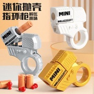 Mini finger decompression ring rotating gun cool and capable of firing shell throwing toy