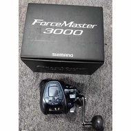 Shimano 22 ForceMaster 3000 electric reel alongside its official packaging. This heavy-duty power as