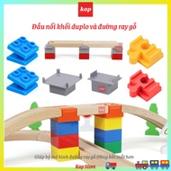 Duplo cube connector linked to wooden train tracks