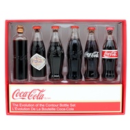 Coca-cola mini evolution bottle, commemorative version glass bottle, evolution bottle, arc, retro-carved bottle, height of about 8 cm