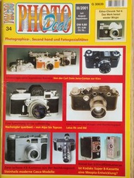 2001年  PHOTO Deal  34Photographica  Second hand  under Fotospezialitaeten 古典二手相機鏡頭專題雜誌內文是德文， 黑白和彩色印刷， 此歐洲最權威的雜誌是專門報導介紹古典收藏相機，集中專題介紹收藏相機項目， 詳細報道有關資料和彩色相片， 今次主題是 Zeiss 1940年初戰時 Contax II 極罕有黑漆焗面， 另外有奶白象牙色焗面，淺啡色皮革!   詳盡資料和有生產紀錄,  比對前蘇聯 Contax-Kiev 珍貴資料