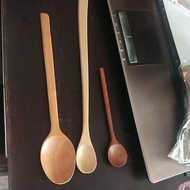Wooden spoon of rice and coffee