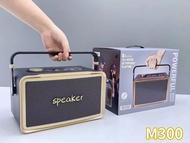 ลำโพงบลูทูธ รุ่นM300 รองรับ AUX/TF/USB แถมไมค์ลอย 2ตัว มีที่หิ้วพกพาง่าย มีสายAUXให้เสียบไมค์สายเพิ่