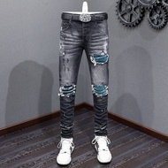 Amiri High Street แฟชั่นผู้ชายใหม่กางเกงยีนส์วินเทจสีเทาดำท้องฟ้าสีฟ้าแพทช์เทคโนโลยีการออกแบบปุ่มกาง