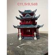 3-storey miniature house model with awning.