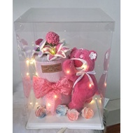 Lotso strawberry bear hugs a wool flower bouquet, transparent strawberry bear box