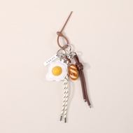 LUNÉA Baguette & Egg Charm – Handmade Bag Accessory, Limited Edition Keychain